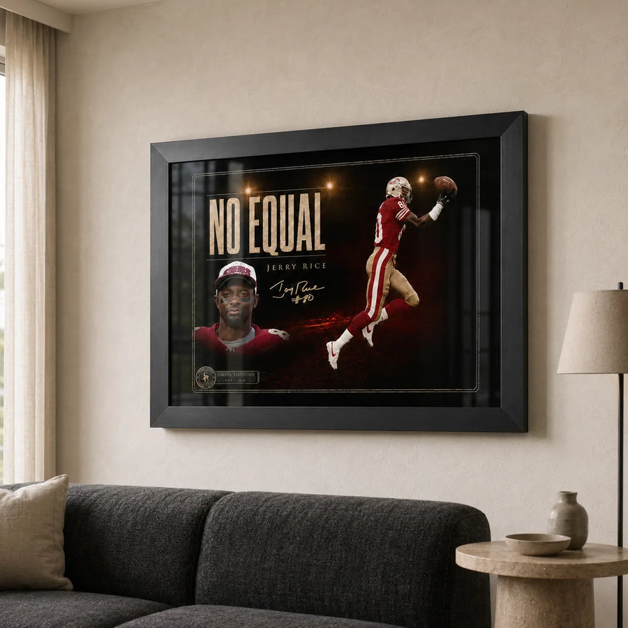 Jerry Rice wall art shown in a bright neutral living room with a black frame above a charcoal sofa.
