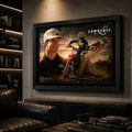 Black framed Jett Lawrence motocross wall art displayed on a charcoal wall in a dark premium man cave.