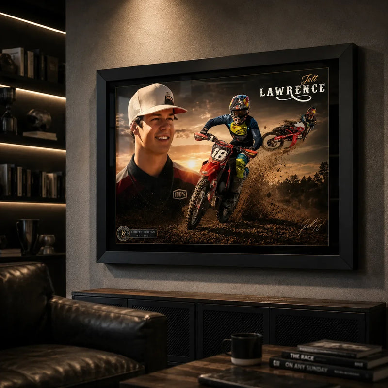 Black framed Jett Lawrence motocross wall art displayed on a charcoal wall in a dark premium man cave.