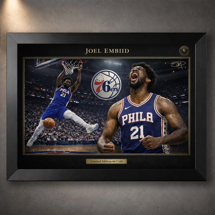 Joel Embiid 76ers NBA wall art shown in a black frame with gold trim and arena action artwork.
