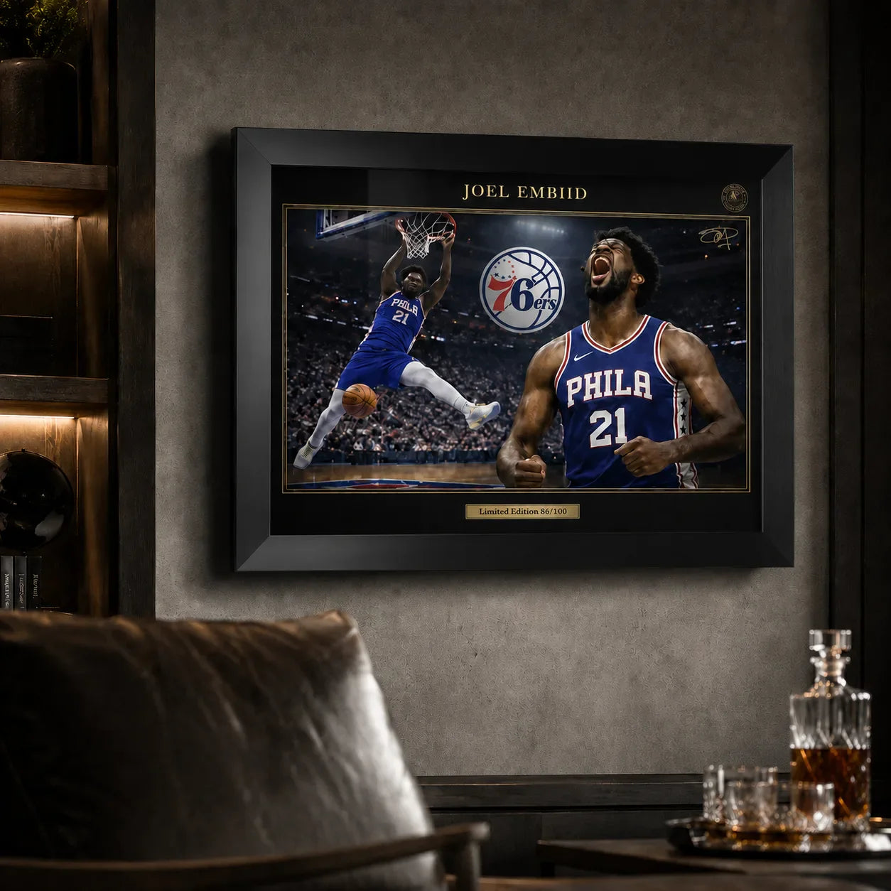 Framed Joel Embiid 76ers basketball artwork displayed in a dark man cave lounge setting.