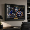 Joel Embiid 76ers framed NBA wall art displayed above a desk in a modern office setting.