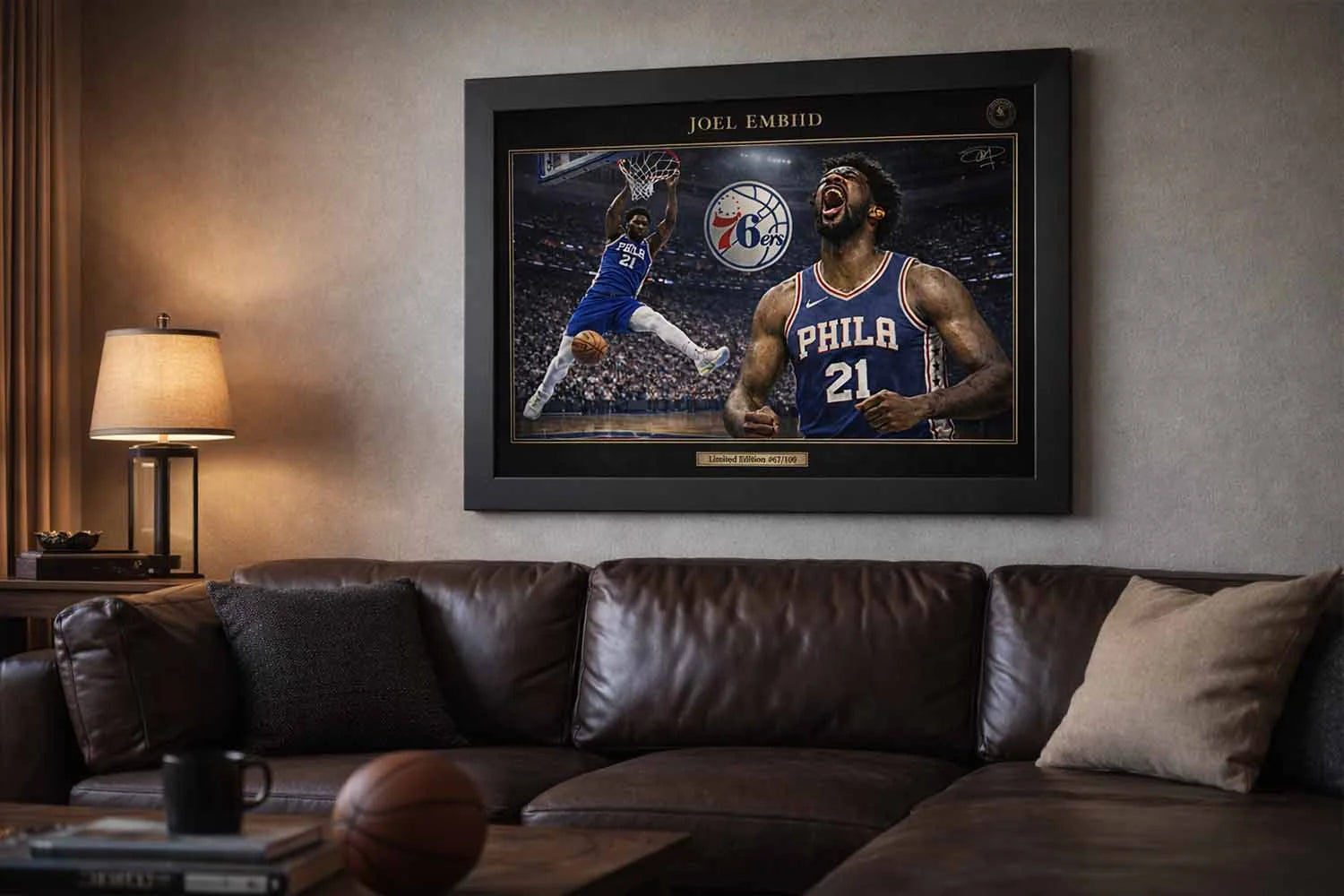 Joel Embiid framed sports wall art displayed above leather sofa in modern basketball fan living room man cave wall décor