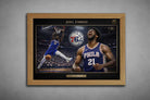 Joel Embiid Philadelphia 76ers premium sports collectibles artwork in oak frame with arena dunk scene and bold hero portrait