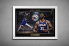 Joel Embiid Philadelphia 76ers framed sports memorabilia poster with arena dunk and celebration portrait in white frame