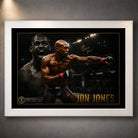 Jon Jones UFC wall art shown in a white frame with black matting and gold detailing against a textured grey wall.