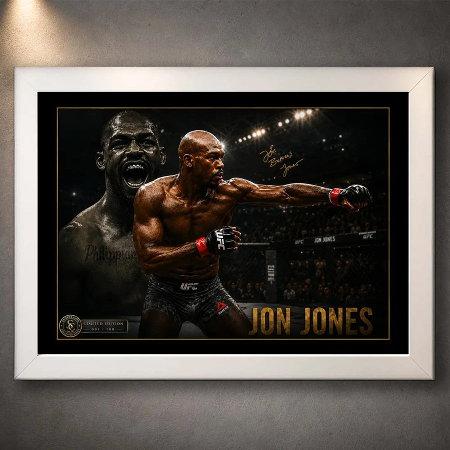 Jon Jones UFC wall art shown in a white frame with black matting and gold detailing against a textured grey wall.