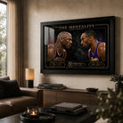 Jordan vs Bryant wall art displayed in a warm contemporary living room above a dark timber console.