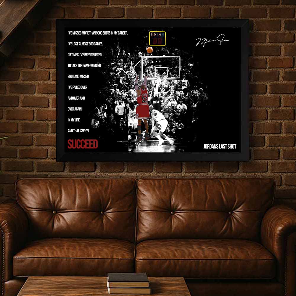 Framed NBA Jordan poster on a brick wall above a brown leather sofa