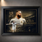 Karim Benzema football wall art in a black frame, featuring Real Madrid tribute artwork in gold tones.