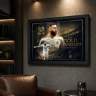 Karim Benzema football wall art in a black frame on a dark man cave wall with warm shelf lighting.