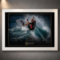 White framed Kelly Slater surfing wall art showing his turn through a breaking wave in a black and gold collector design.