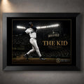 Ken Griffey Jr. The Kid baseball wall art shown in a premium black frame with the iconic swing under stadium lights.