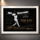 Ken Griffey Jr. The Kid baseball wall art shown in a clean white frame against a softly lit textured wall.