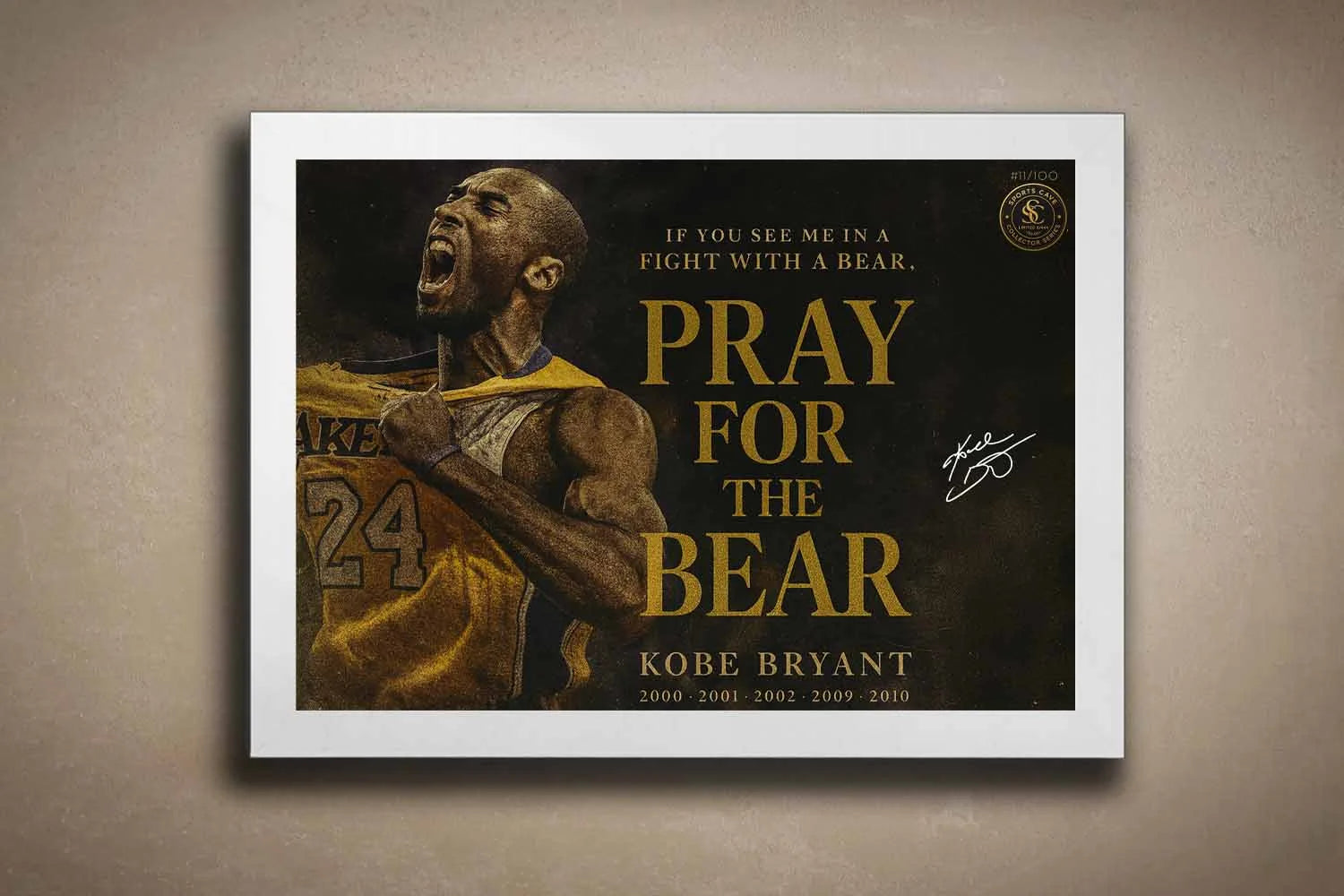 Kobe Bryant Pray For The Bear NBA sports wall art in white frame on textured wall.