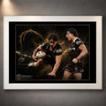 White framed Kotoni Staggs Brisbane Broncos rugby league wall art featuring two action portraits on a black and gold design.