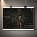 Last shot basketball print hanging from clips on a grey wall.