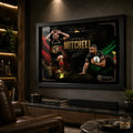 Black framed Latrell Mitchell wall art displayed in a dark man cave with warm shelving and leather seating.