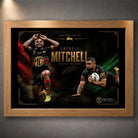 Oak framed Latrell Mitchell wall art featuring two action poses in South Sydney colours on a dark red and green design.