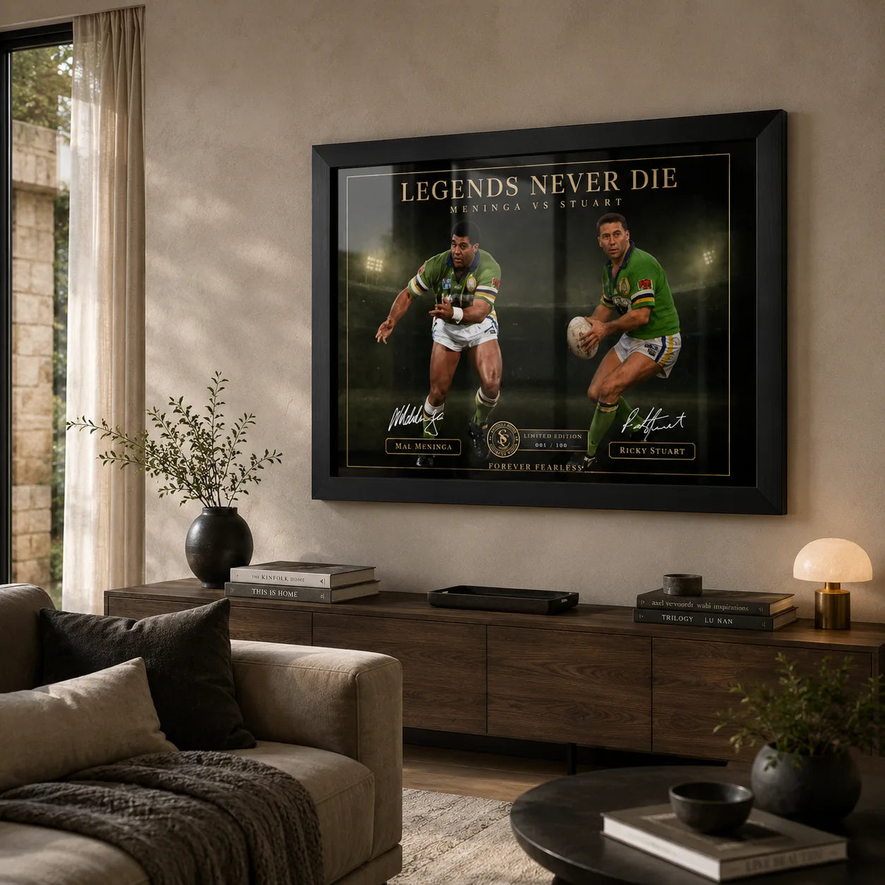 Meninga vs Stuart wall art displayed in a warm living room above a timber console with soft natural light.