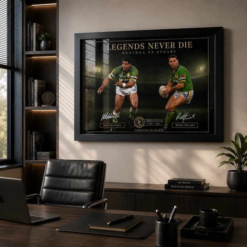 Meninga vs Stuart wall art displayed in a modern office above dark timber furniture and a black leather chair.