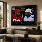 Lockdown VS Unstoppable Jerry Rice and Deion Sanders wall art displayed in a modern living room with a black frame.