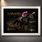 Lonhro horse racing wall art displayed in a white frame against a textured grey wall with soft overhead lighting.