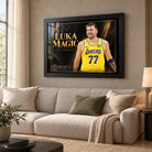 Luka Doncic Luka Magic edition in a black frame above a cream sofa in a bright living room with neutral furnishings.