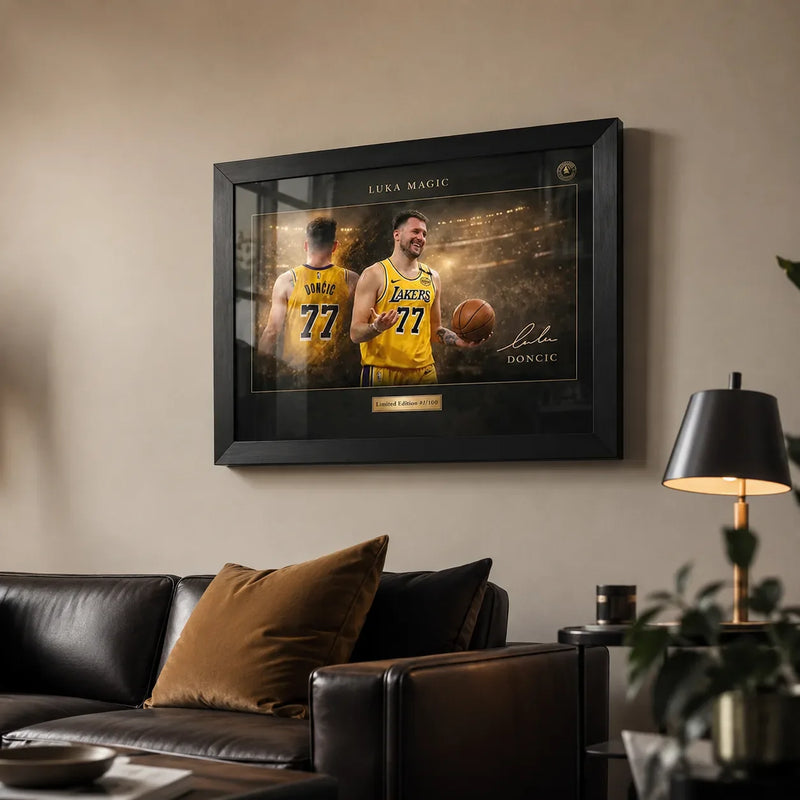 Luka Dončić black framed NBA wall art displayed above a leather sofa in a premium living room.