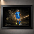 Mackenzie Arnold Matilda's sports wall art shown in a black frame with a goalkeeper portrait and stadium scene.
