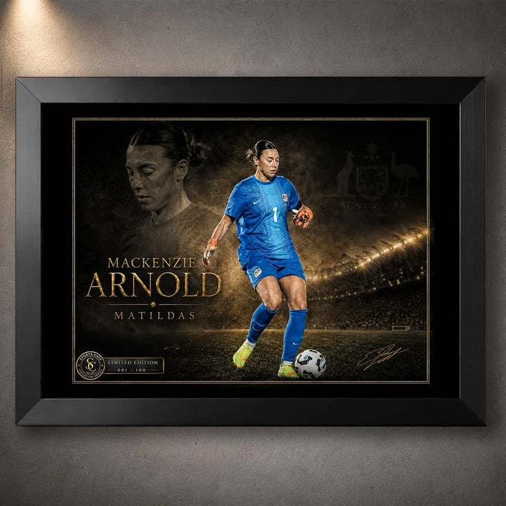 Mackenzie Arnold Matilda's sports wall art shown in a black frame with a goalkeeper portrait and stadium scene.