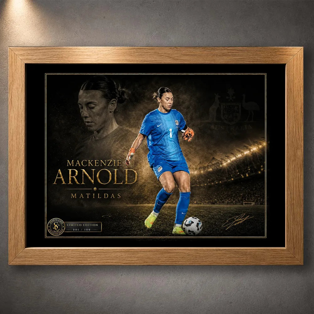 Mackenzie Arnold Matilda's sports wall art shown in an oak frame with the full goalkeeper collector artwork visible.