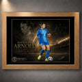 Mackenzie Arnold Matilda's sports wall art shown in an oak frame with the full goalkeeper collector artwork visible.