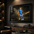 Mackenzie Arnold Matilda's sports wall art in a black frame displayed in a dark premium sports room.