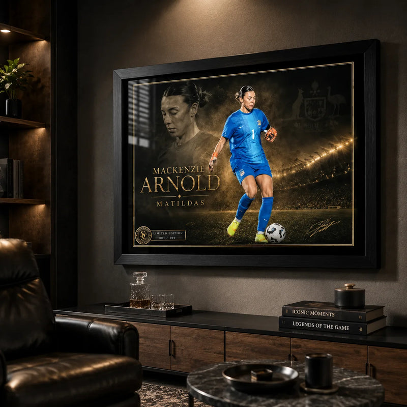 Mackenzie Arnold Matilda's sports wall art in a black frame displayed in a dark premium sports room.