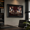 Manly Legends Steve Menzies and Cliff Lyons wall art displayed in a modern office with a black frame.