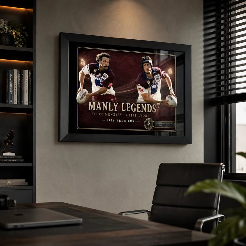 Manly Legends Steve Menzies and Cliff Lyons wall art displayed in a modern office with a black frame.