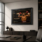 Manny Pacquiao boxing wall art in a black frame above a cabinet in a modern office with a desk and city window.