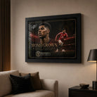 Marcus Rashford football wall art in a black frame displayed in a modern living room.