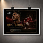 Marcus Rashford football wall art print hanging unframed from clips against a grey wall.