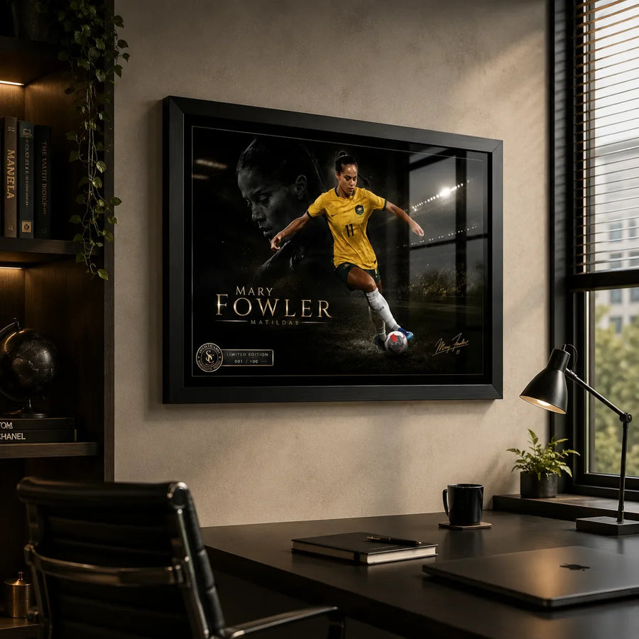 Mary Fowler wall art displayed in a modern home office with a black frame, desk, shelving and natural window light.