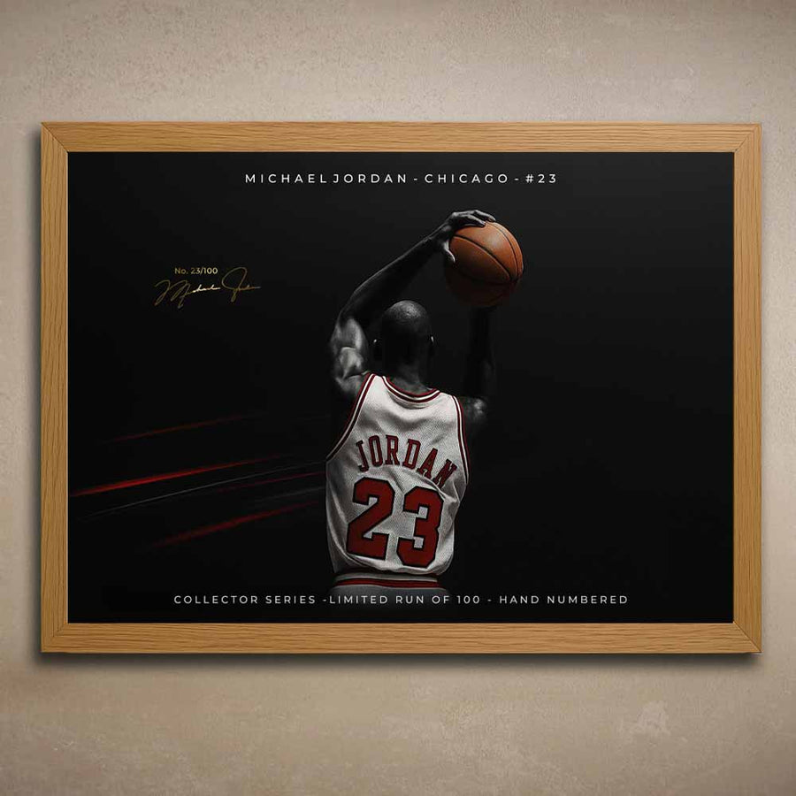 Oak framed artwork of NBA player Michael Jordan in a Chicago jersey with a dark background.
