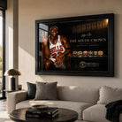 Michael Jordan wall art displayed in a bright contemporary living room above a neutral sofa in a black frame.