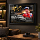 Bill Elliott Million Dollar Bill wall art displayed in a dark man cave with warm shelving and leather seating.
