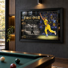 Mitchell Starc The First Over edition in a black frame on a charcoal wall above a pool table in a cricket collector room.