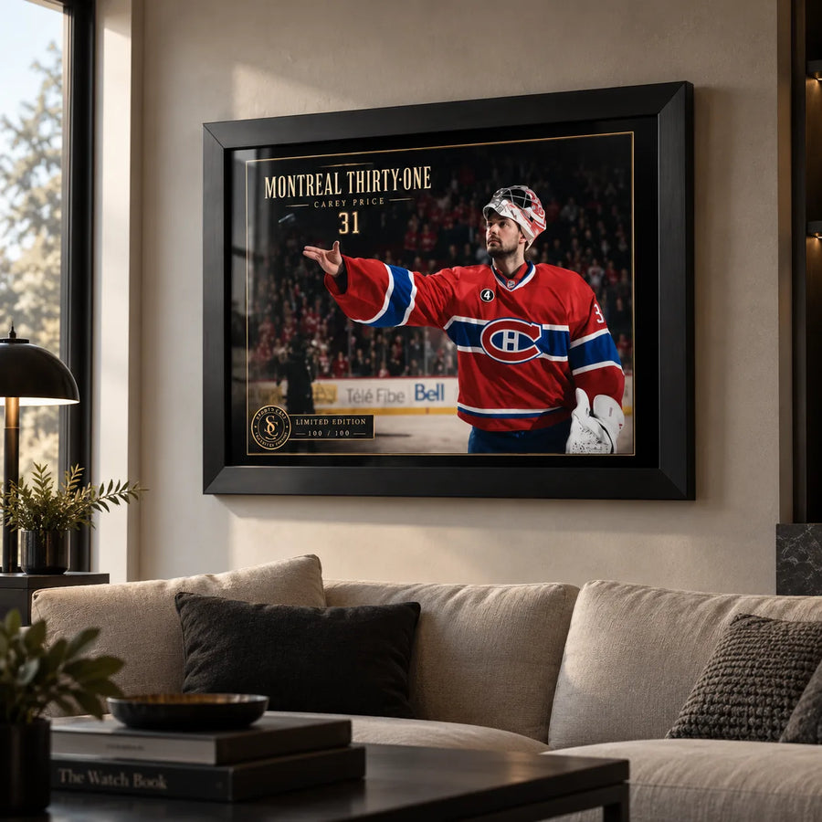 Carey Price wall art displayed above a light sofa in a modern office or lounge with natural window light.