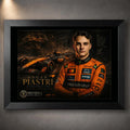 Motorsport wall art in a black frame with racing artwork on a dark wall backdrop.