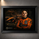 Motorsport wall art in a black frame with racing artwork on a dark wall backdrop.