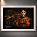 Motorsport wall art in a white frame, showing orange racing artwork and portrait on a grey wall.