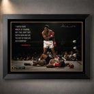 Muhammad Ali Live Like a Champion wall art in a black frame, featuring the iconic knockout scene and motivational quote.